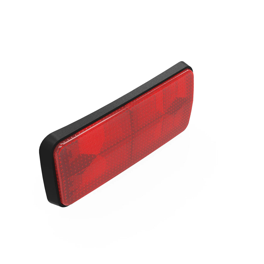 John Deere AM103060 reflector showing high-visibility surface, designed to enhance visibility for farmers and contractors.