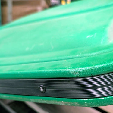 John Deere OEM canopy in green with some wear, designed for outdoor use on agricultural equipment.