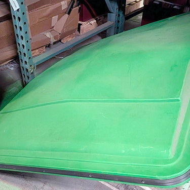 John Deere OEM canopy in green with visible wear, designed for agricultural machinery, showing the canopy's weathered surface.
