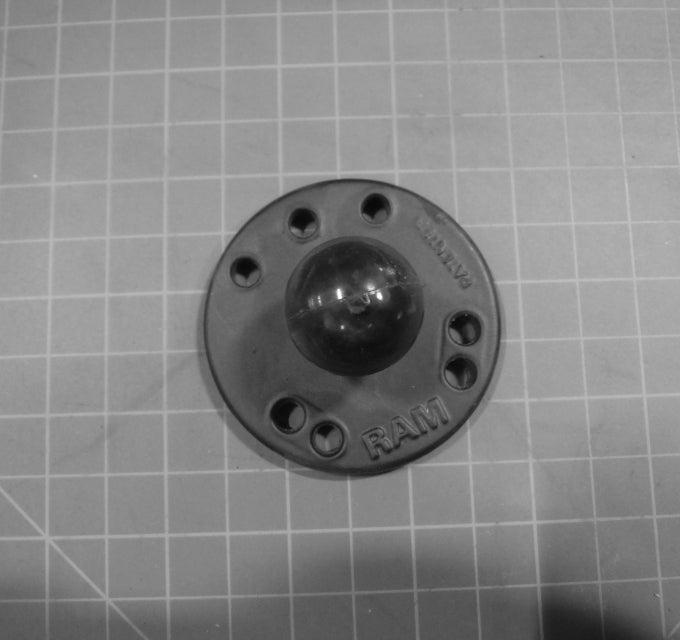 Aerway 10033184 round base ram mount for lawn mowers, durable 1-inch mount for professional use, shown on a lawn mower.